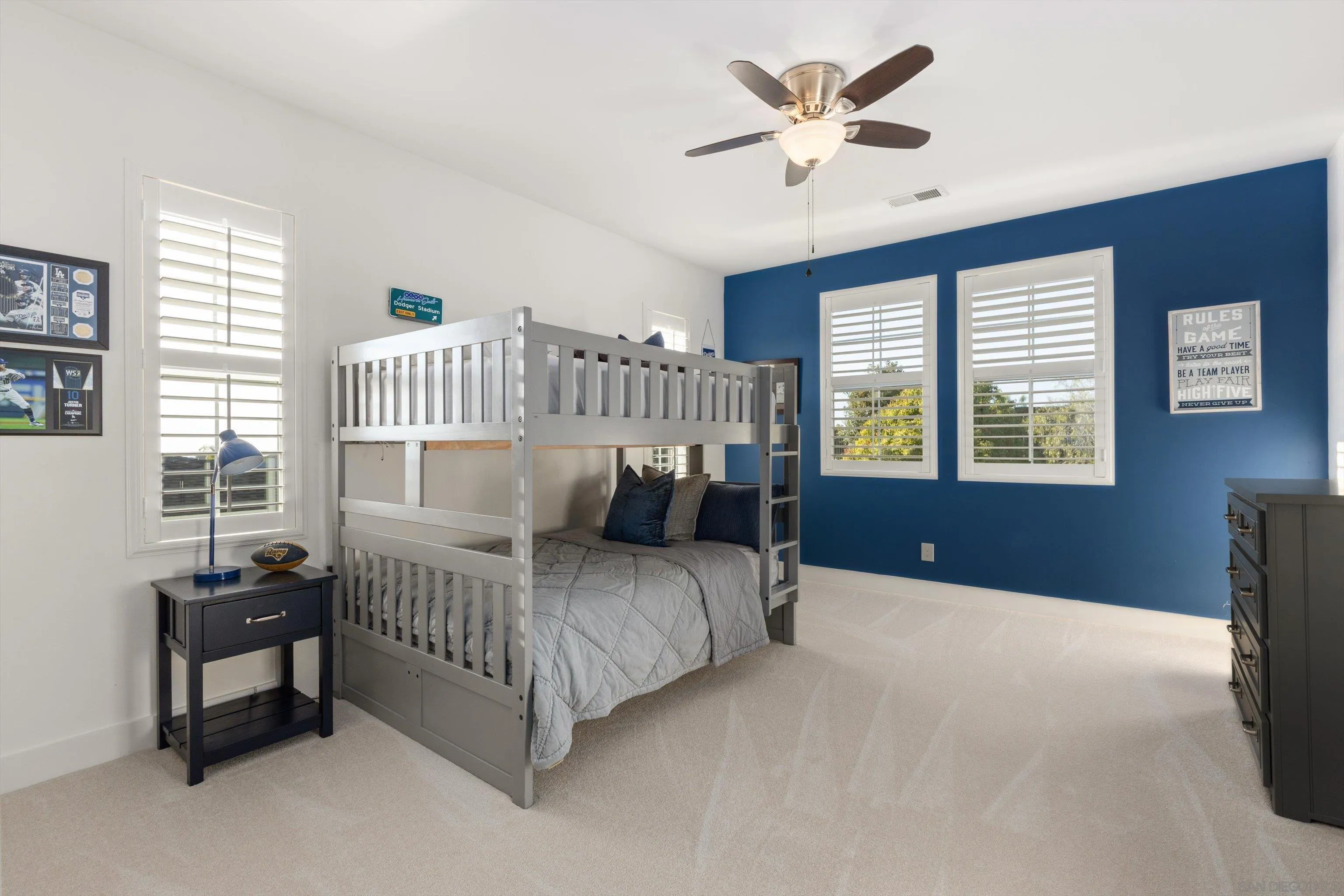 869 Channel Island Drive Encinitas, CA 92024 - Photo 16 of 21 a bedroom with a bed and a chandelier