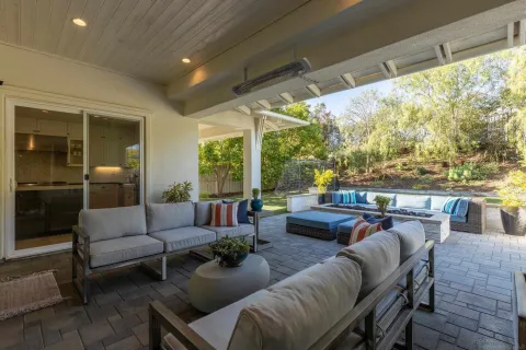 a outdoor living space with furniture and city view