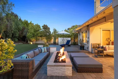 a view of swimming pool with outdoor seating and a potted plant