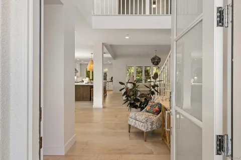 a view of a hallway with dining area and livingroom view