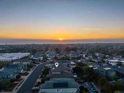 an aerial view of residential houses and city view