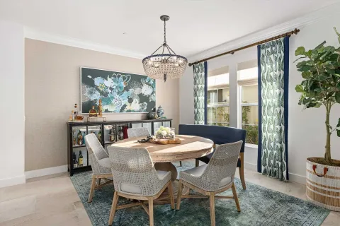 a dining room with furniture window and outside view