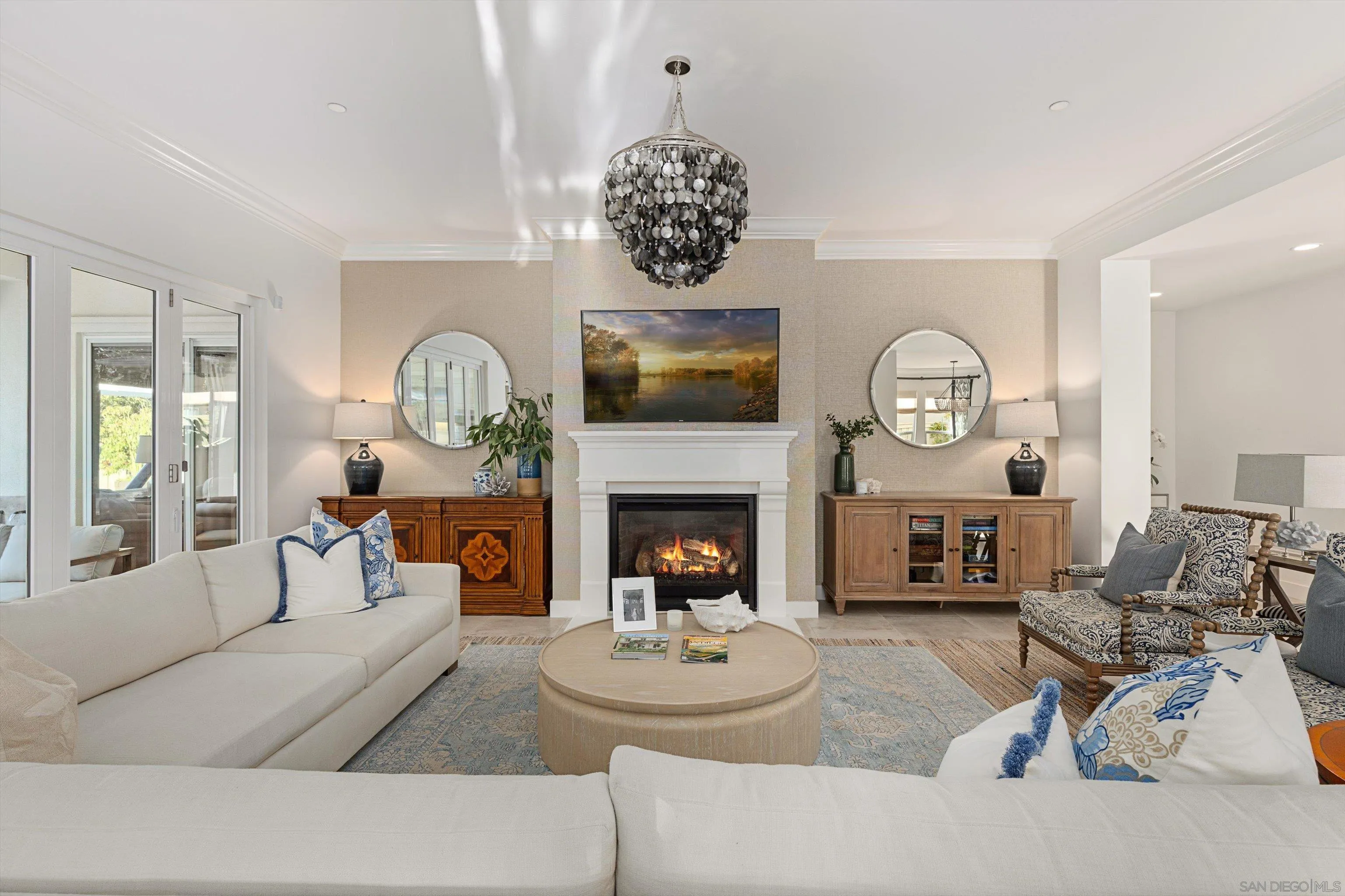 869 Channel Island Drive Encinitas, CA 92024 - Photo 7 of 21 a living room with furniture a fireplace and a large mirror
