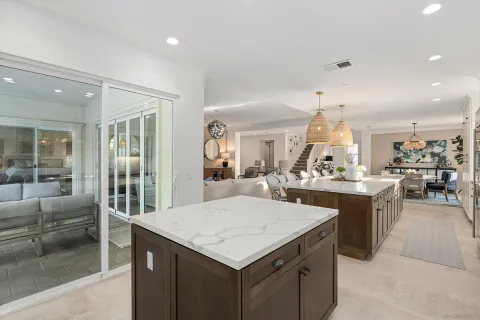 a kitchen with a sink a counter top space and stainless steel appliances