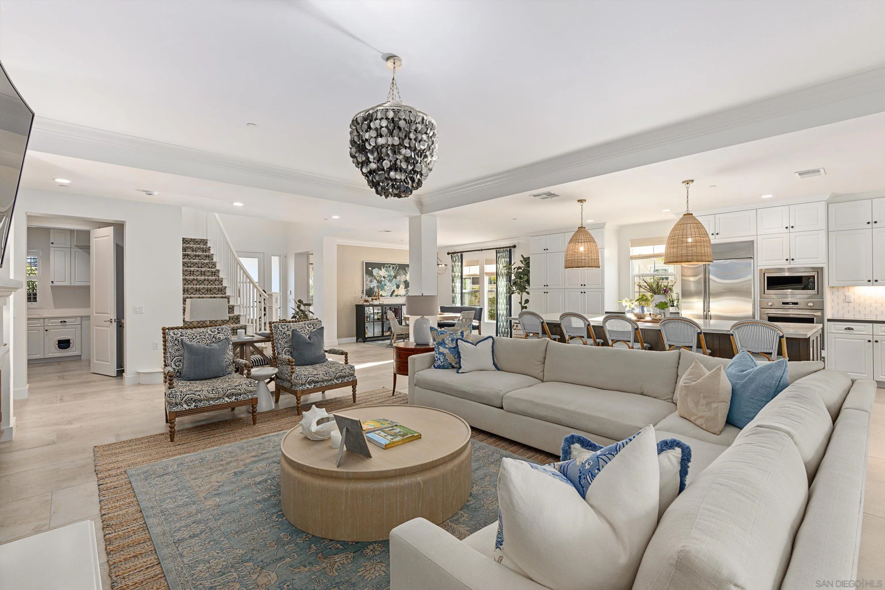 869 Channel Island Drive Encinitas, CA 92024 - Photo 9 of 21 a living room with furniture a chandelier and a large window