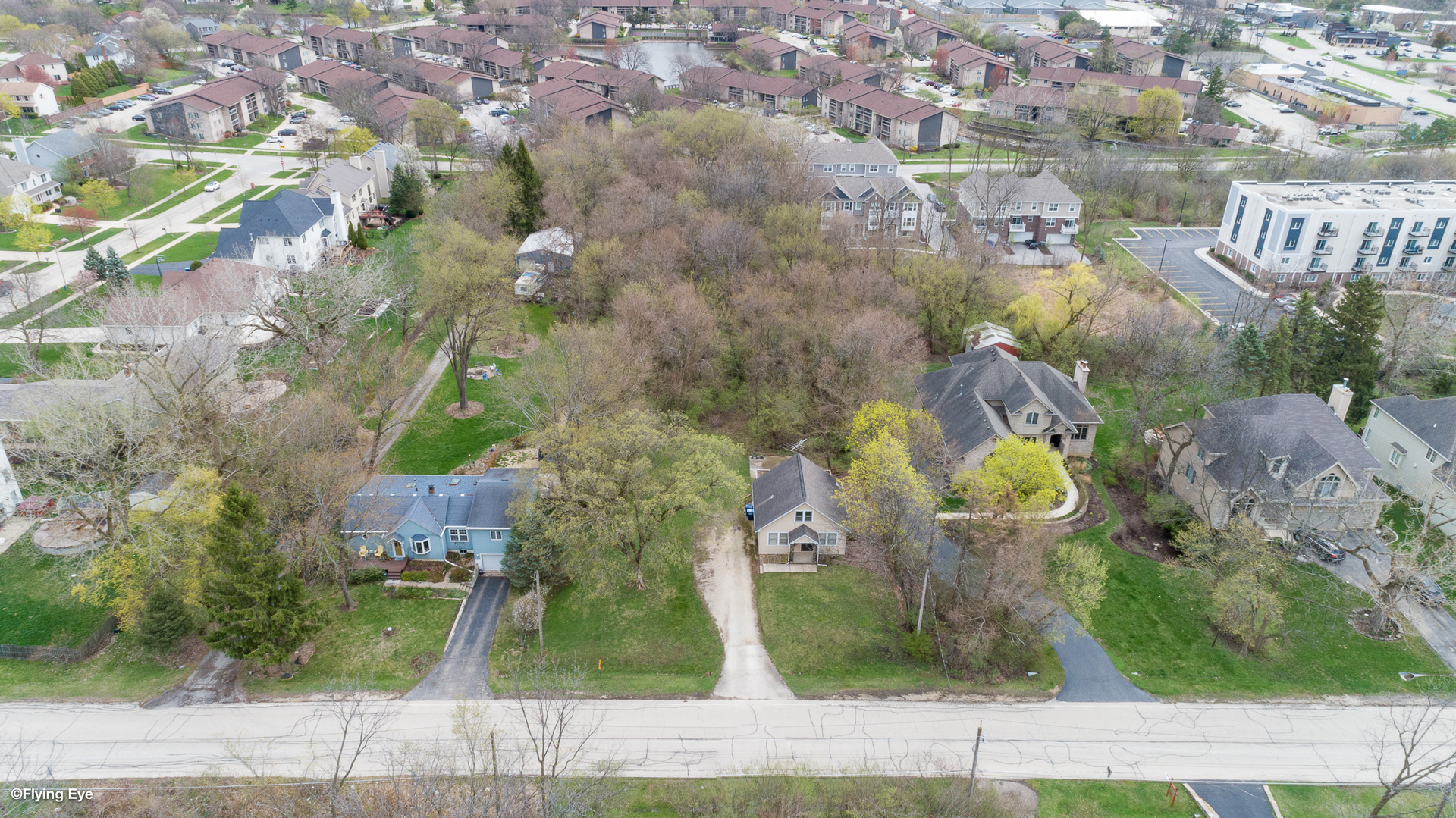 an aerial view of waterside residential houses with outdoor space