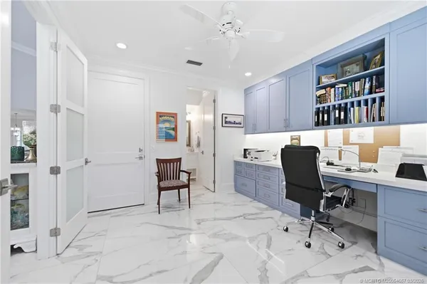 a view of a workspace with furniture