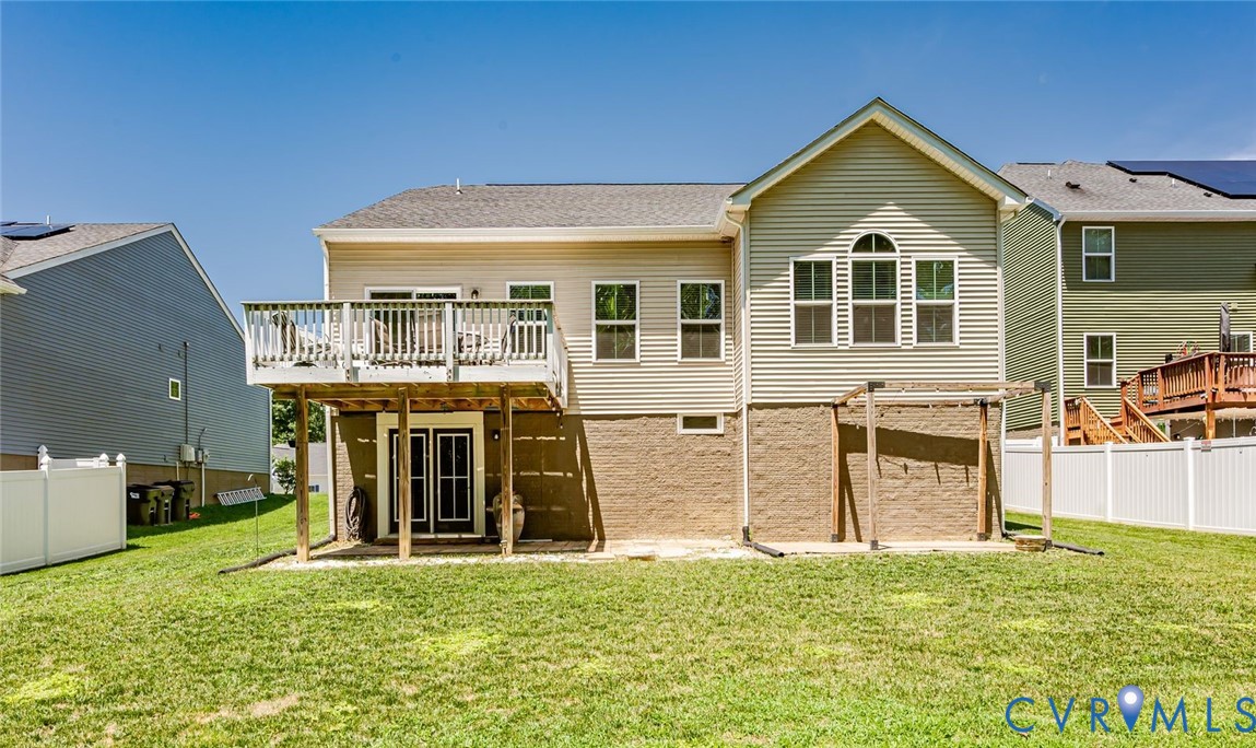 7435 Wicks Road Williamsburg, VA 23188 - Photo 79 of 82 Rear exterior featuring an elevated deck with whit
