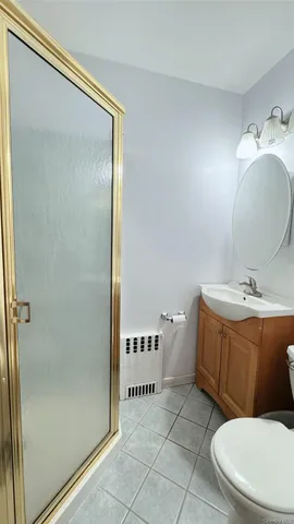 a bathroom with a toilet a sink and shower