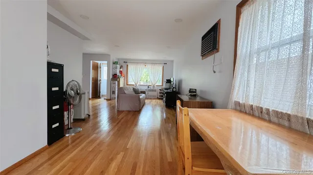 a view of a living room and dining room