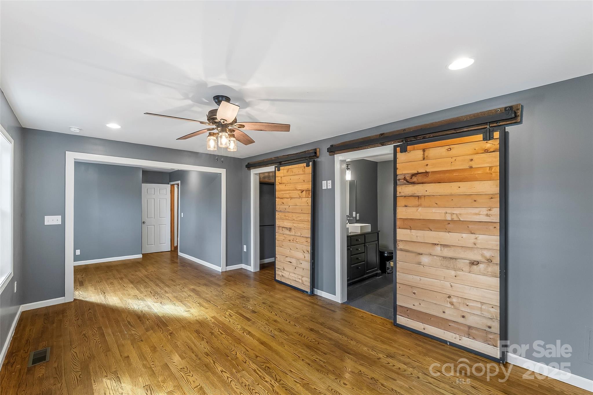 103 Clark Street Marion, NC 28752 - Photo 13 of 34 wooden floor in an empty room with a window