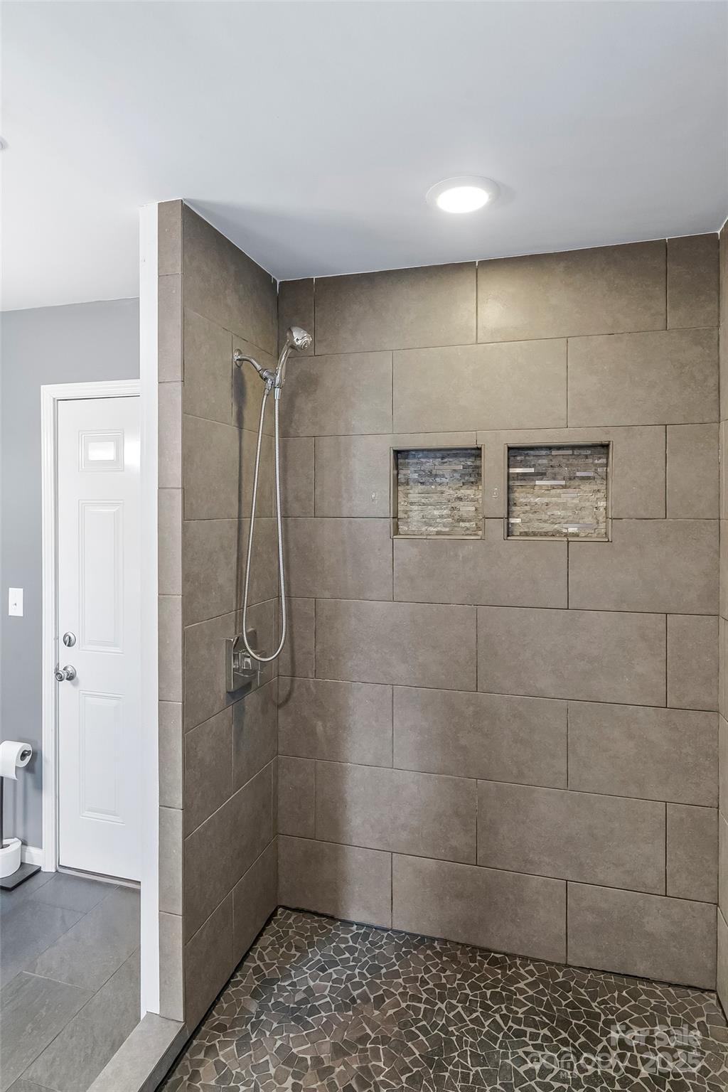 103 Clark Street Marion, NC 28752 - Photo 19 of 34 a bathroom with a shower