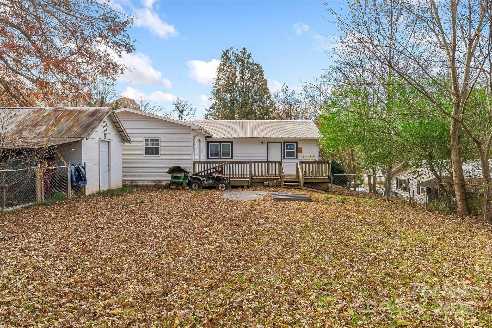 103 Clark Street Marion, NC 28752 - Photo 27 of 34 a view of a house with backyard