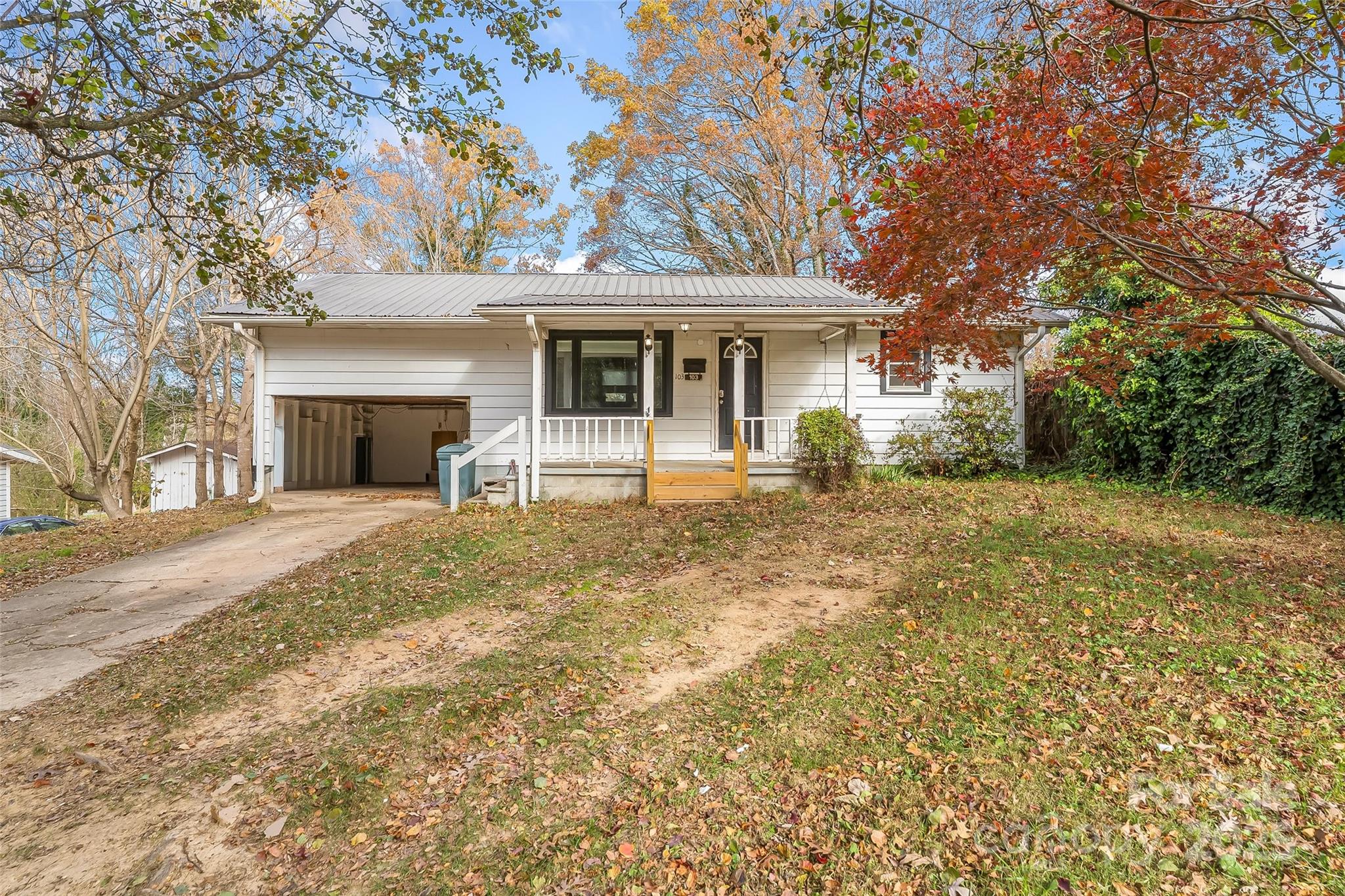 103 Clark Street Marion, NC 28752 - Photo 34 of 34 a front view of a house with garden