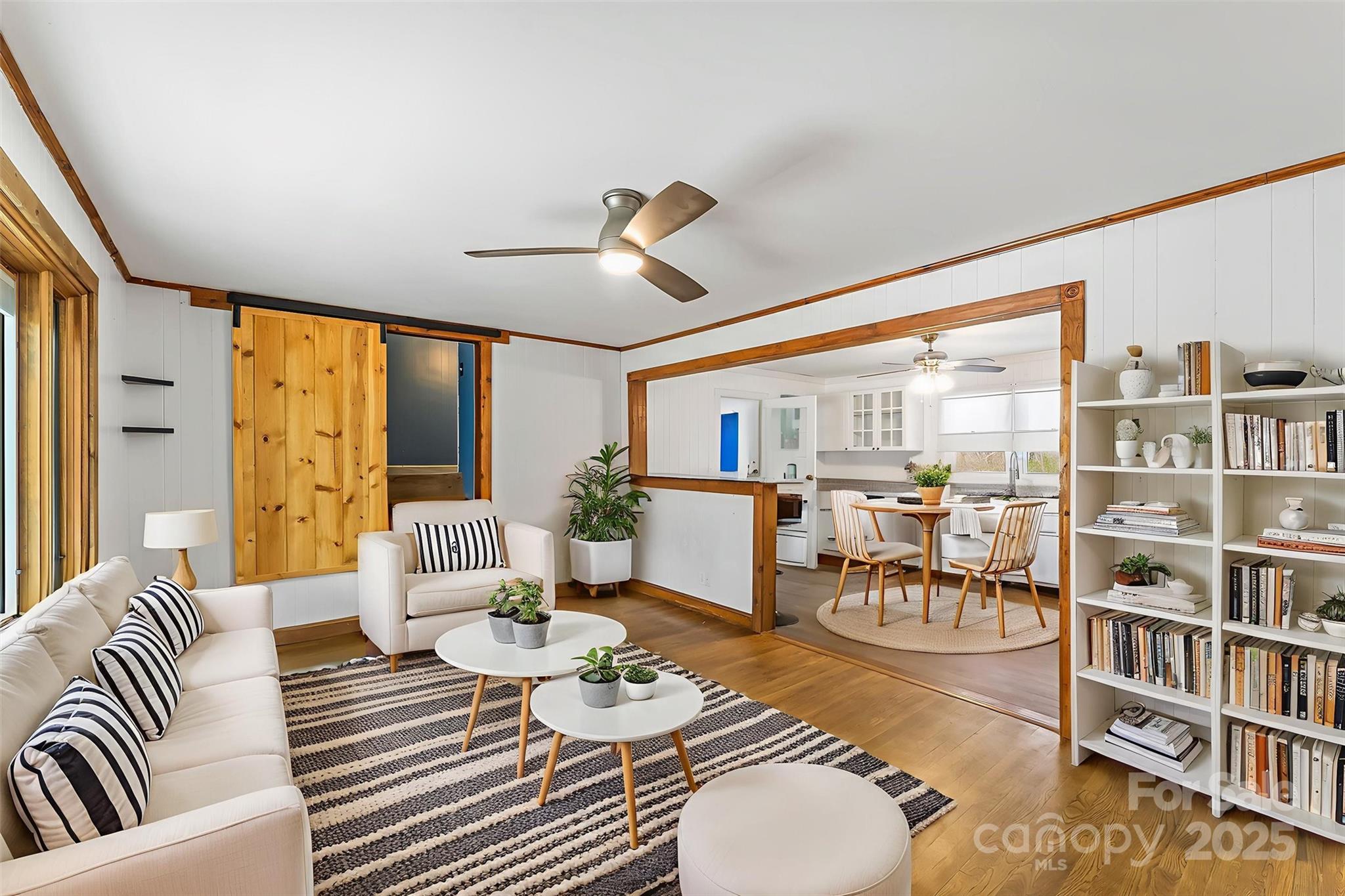 103 Clark Street Marion, NC 28752 - Photo 6 of 34 a living room with furniture kitchen view and large windows