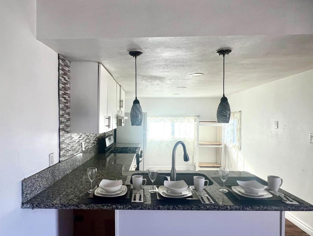 a table with chairs and a wooden floor