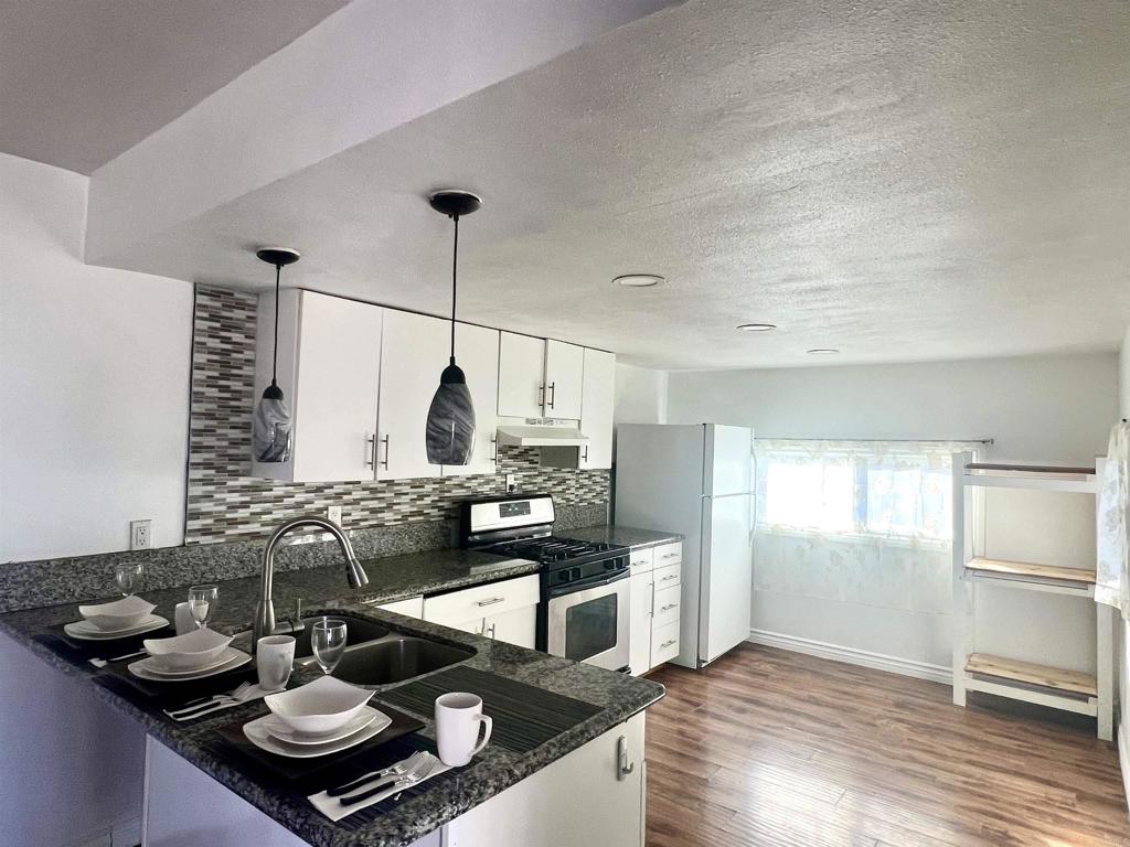 10707 Jamacha Boulevard, Unit 72 Spring Valley, CA 91978 - Photo 15 of 18 a kitchen with granite countertop lots of counter top space