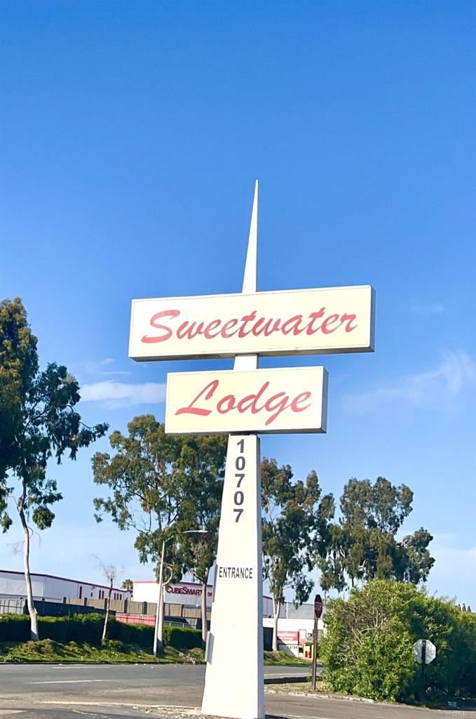 10707 Jamacha Boulevard, Unit 72 Spring Valley, CA 91978 - Photo 5 of 18 a street sign on a wall next to a road
