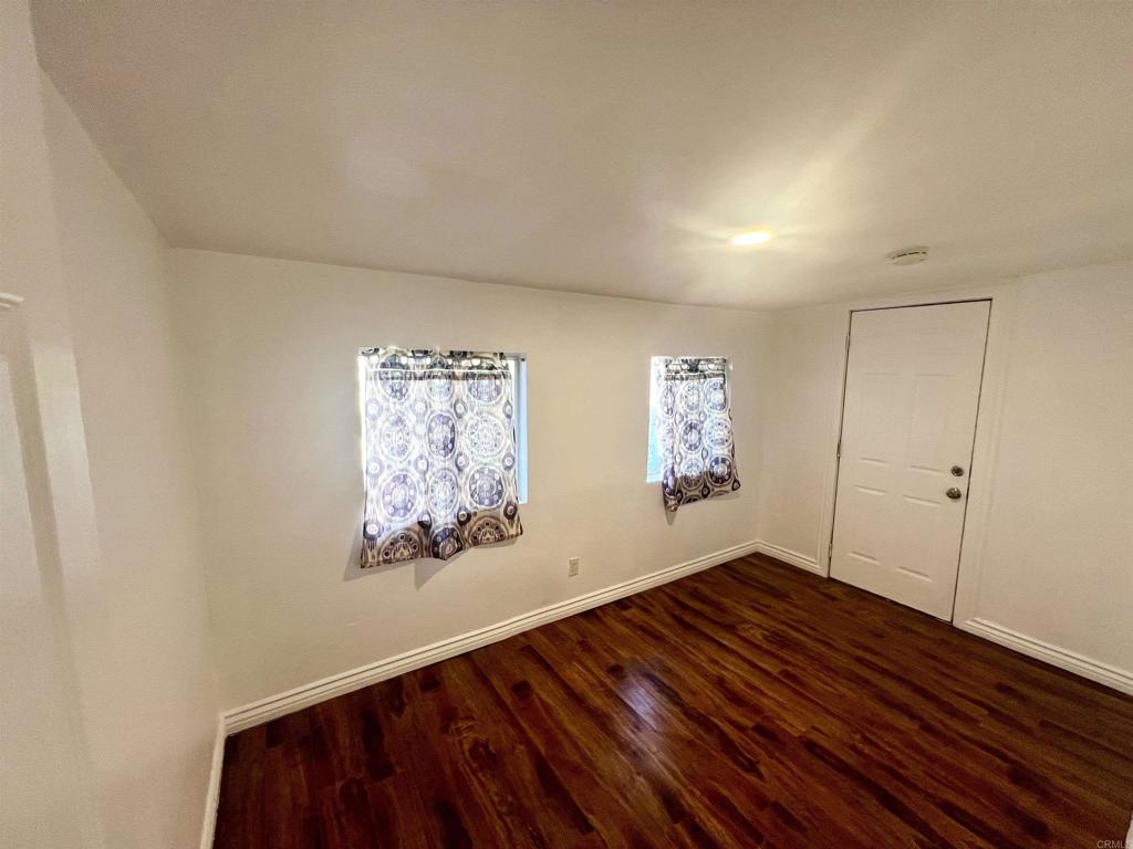 10707 Jamacha Boulevard, Unit 72 Spring Valley, CA 91978 - Photo 10 of 18 a view of an empty room and wooden floor