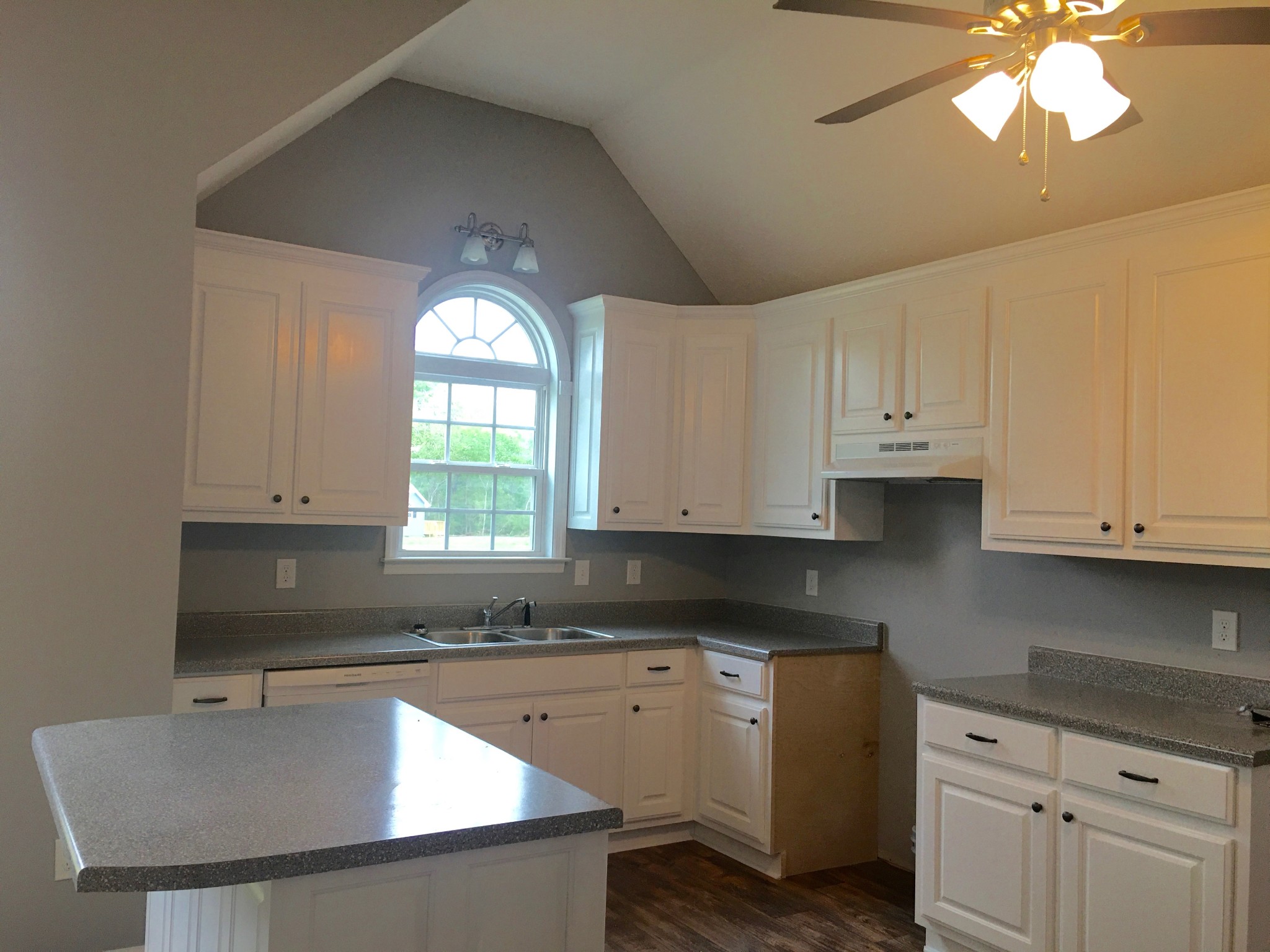 538 B Limestone Road Elora, TN 37328 - Photo 5 of 19 a kitchen with granite countertop a sink window and cabinets
