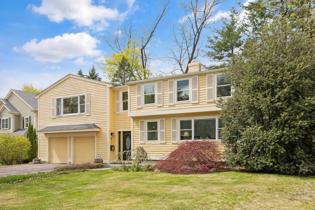 16 Dee Road Lexington, MA 02420 - Photo 2 of 30 a front view of a house with a garden and swimming pool