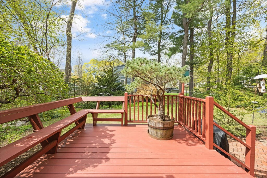 16 Dee Road Lexington, MA 02420 - Photo 26 of 30 a view of a balcony with wooden floor and fence