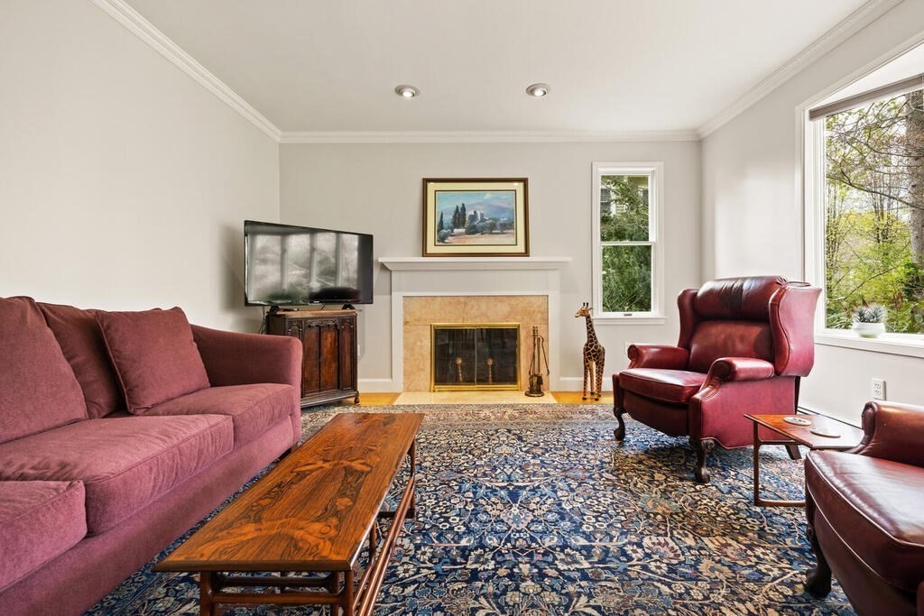 16 Dee Road Lexington, MA 02420 - Photo 3 of 30 a living room with furniture a window and a fireplace
