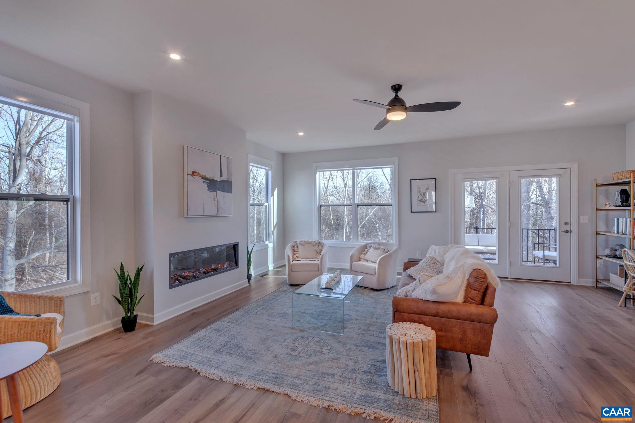 1824 Fowler Street Charlottesville, VA 22901 - Photo 12 of 33 a living room with furniture a wooden floor and a window