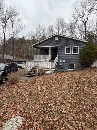 a house with trees in the background
