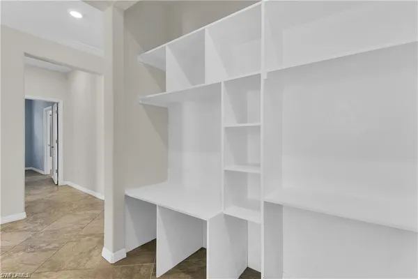 a view of an empty walk in closet