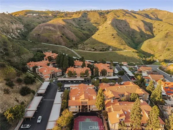 an aerial view of residential houses with outdoor space