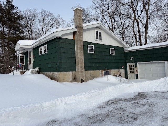 4 Ashley Road North Brookfield, MA 01535 - Photo 3 of 5 a view of a house with a yard covered in snow