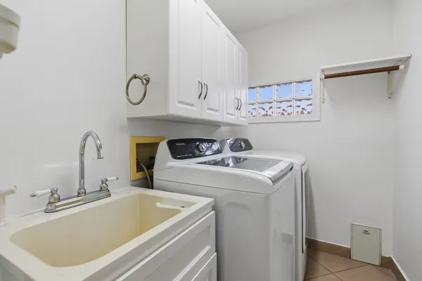 a bathroom with a sink and a washing machine