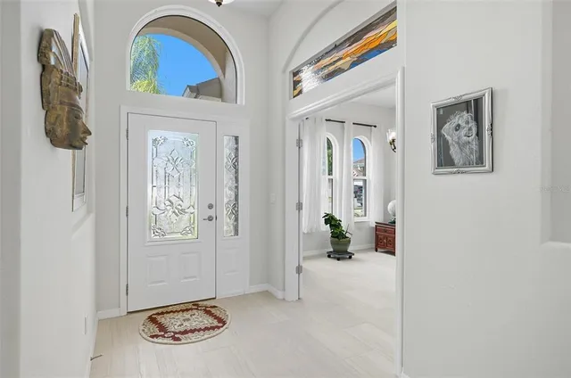 a view of an entryway with wooden floor
