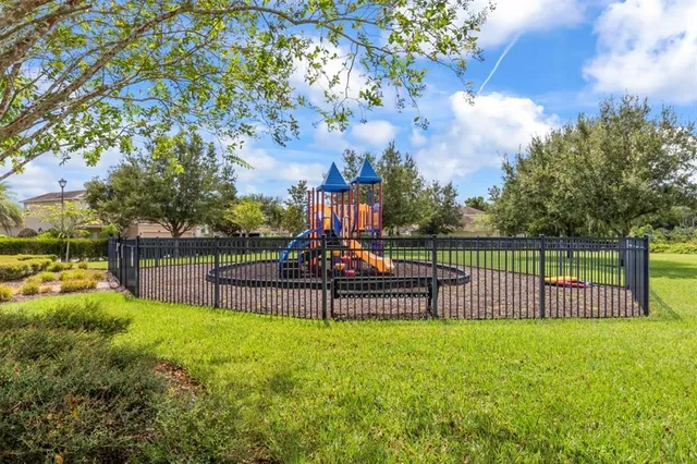 an aerial view of a swimming pool patio and outdoor seating