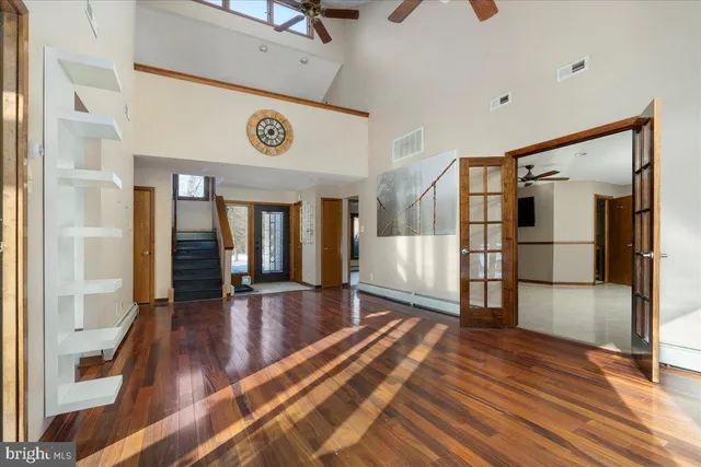 a view of an entryway with wooden floor