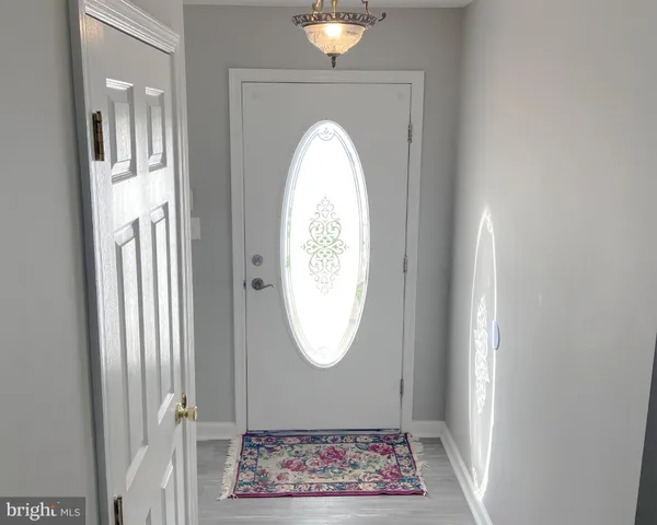 a view of entryway with wooden floor
