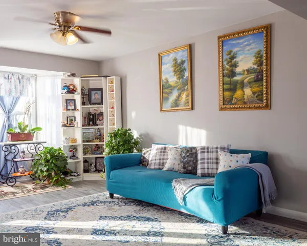 a living room with furniture and a rug