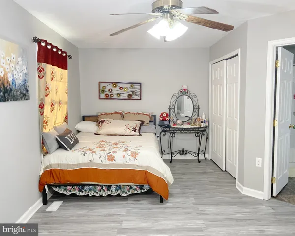 a bedroom with bed and window