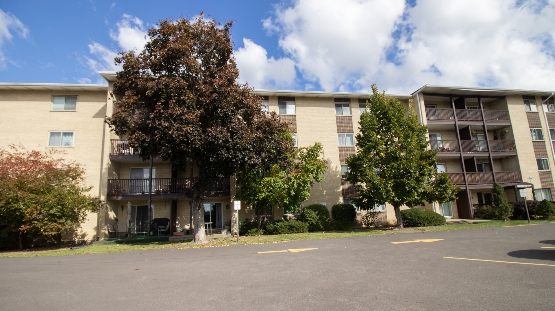 a front view of a building with street view