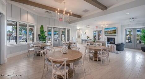 75 Thurnham Lane St. Augustine, FL 32092 - Photo 5 of 18 a view of a dining room with furniture window and wooden floor