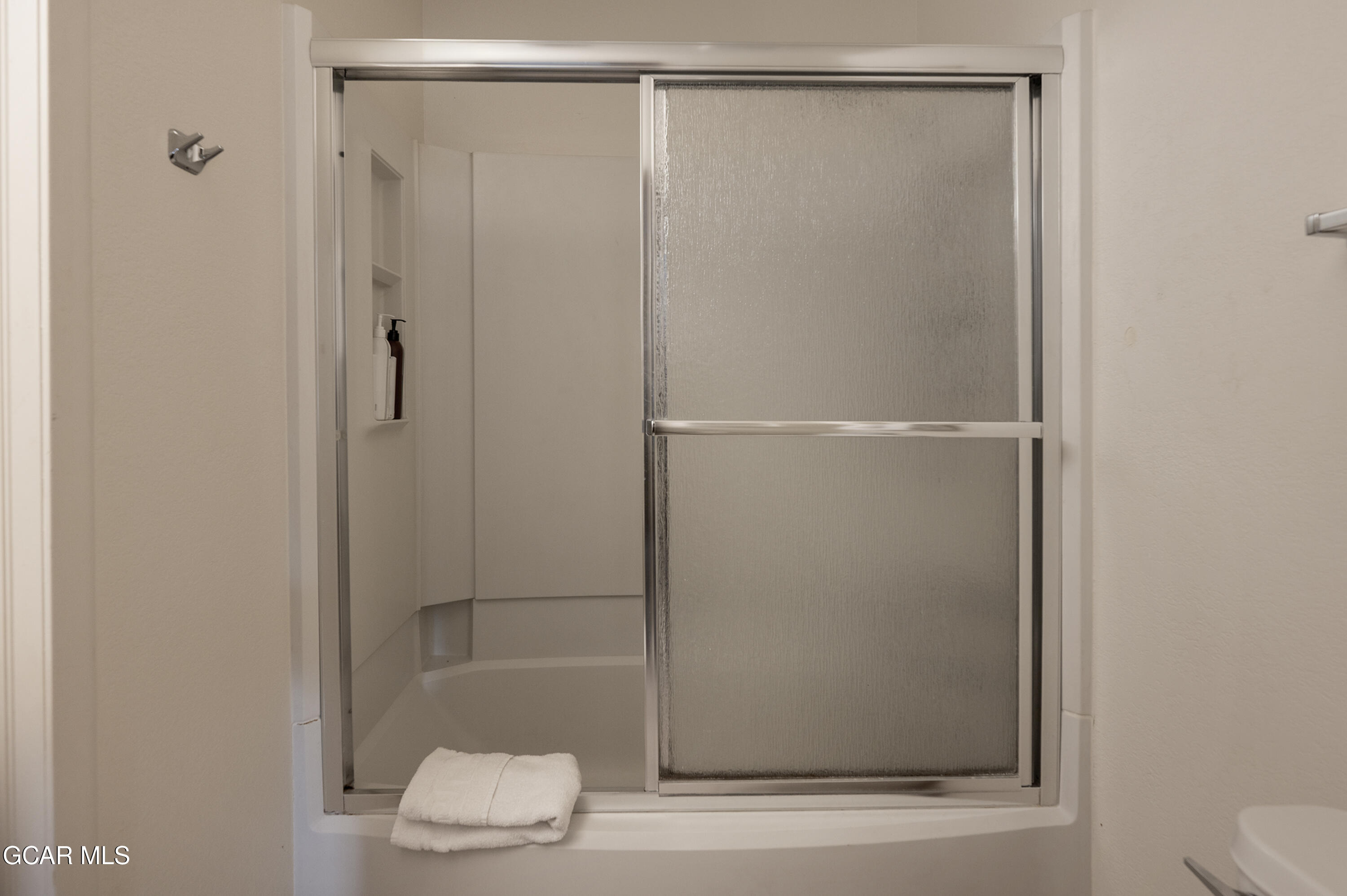 490 Kings Crossing Road, Unit 331 Winter Park, CO 80482 - Photo 19 of 38 a bathroom with a glass shower door