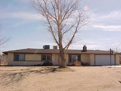 11835 Wapato Road Apple Valley, CA 92308 - Photo 1 of 1 a front view of a house with a yard
