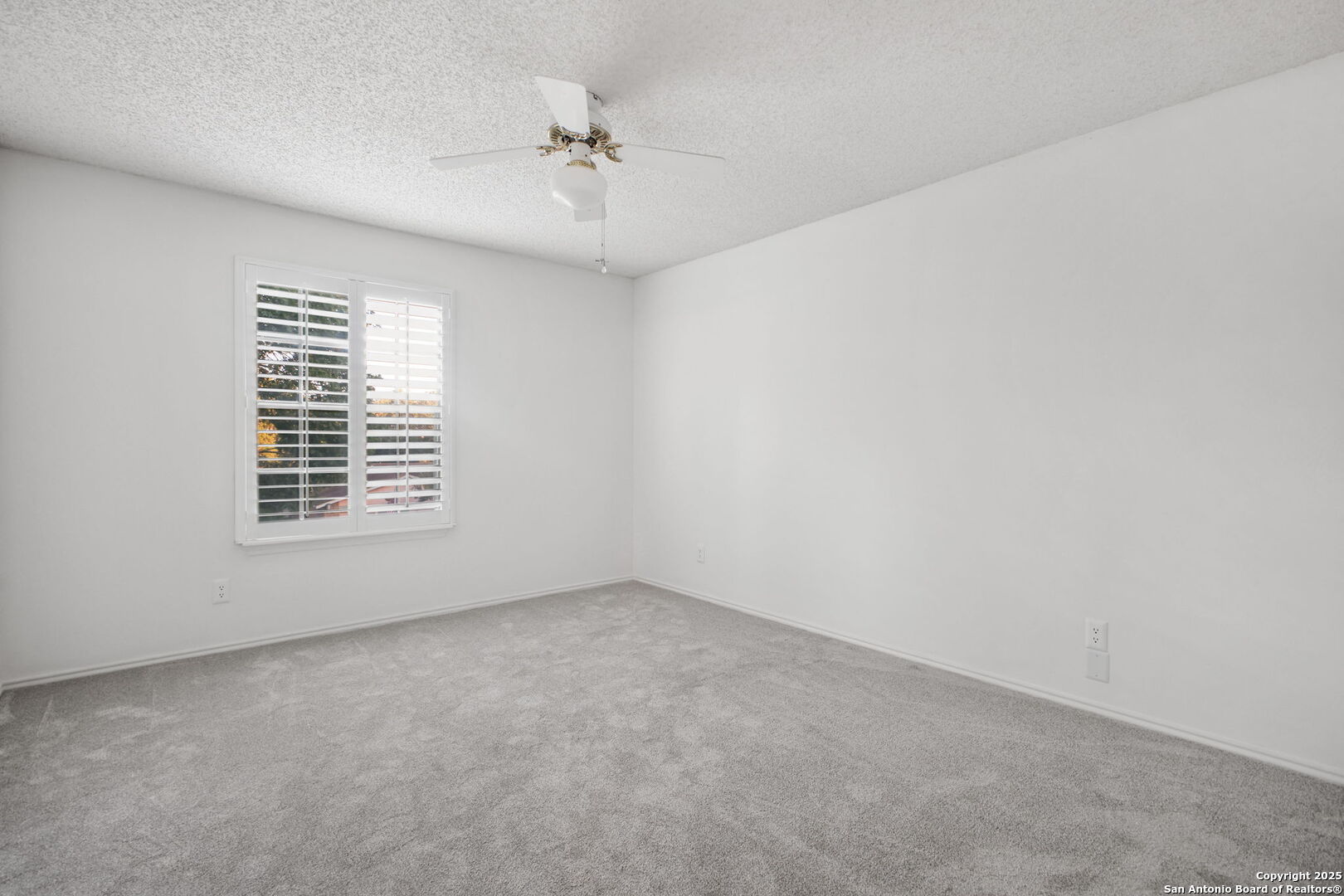 15319 Pebble Path San Antonio, TX 78232 - Photo 20 of 29 a view of an empty room with a window
