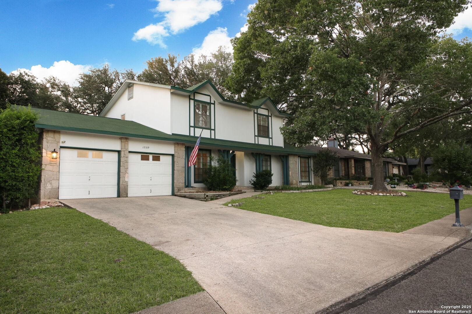 15319 Pebble Path San Antonio, TX 78232 - Photo 2 of 29 a front view of a house with a yard and garage