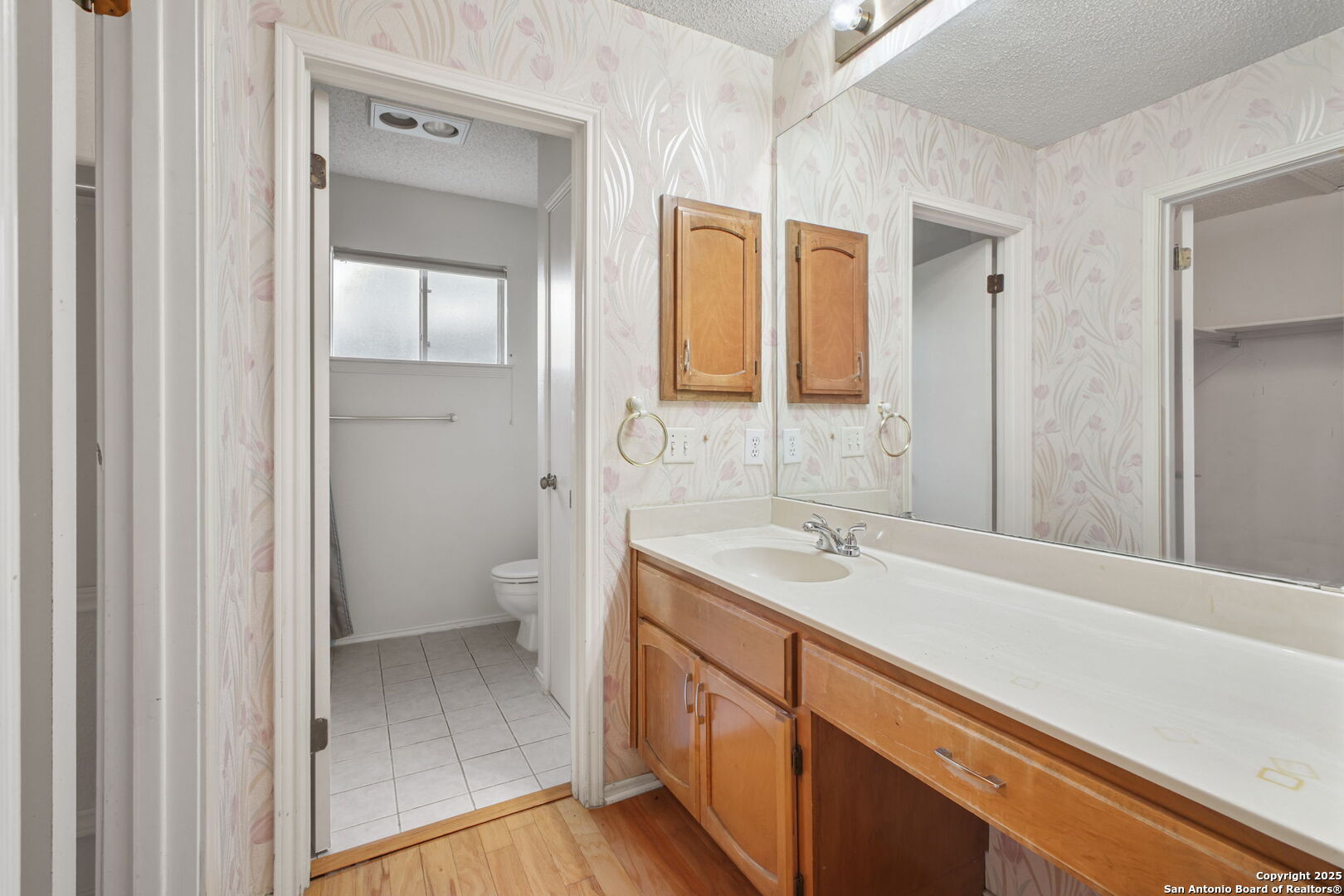 15319 Pebble Path San Antonio, TX 78232 - Photo 23 of 29 a bathroom with a sink and a mirror