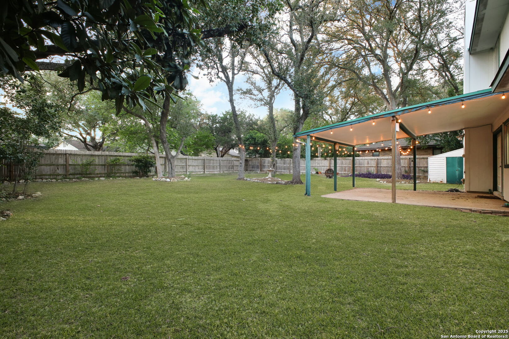 15319 Pebble Path San Antonio, TX 78232 - Photo 24 of 29 a view of a house with a yard porch and sitting area