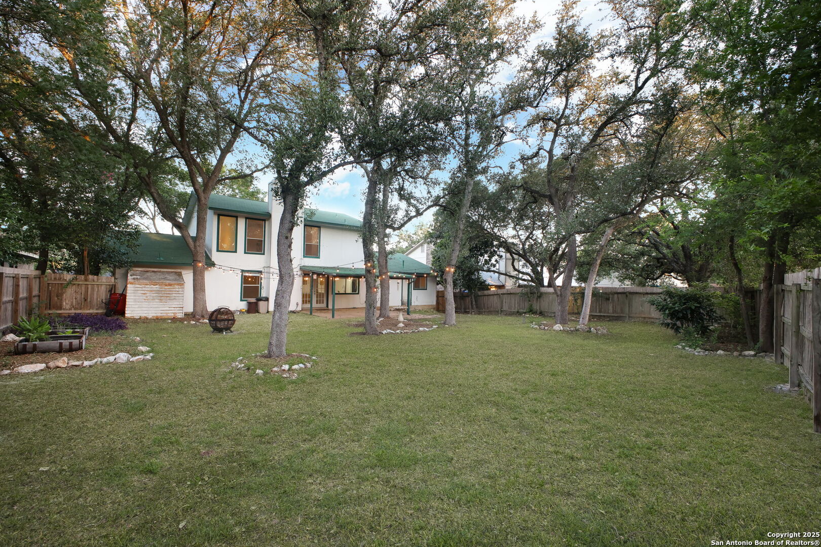 15319 Pebble Path San Antonio, TX 78232 - Photo 26 of 29 a tree in a backyard of a house