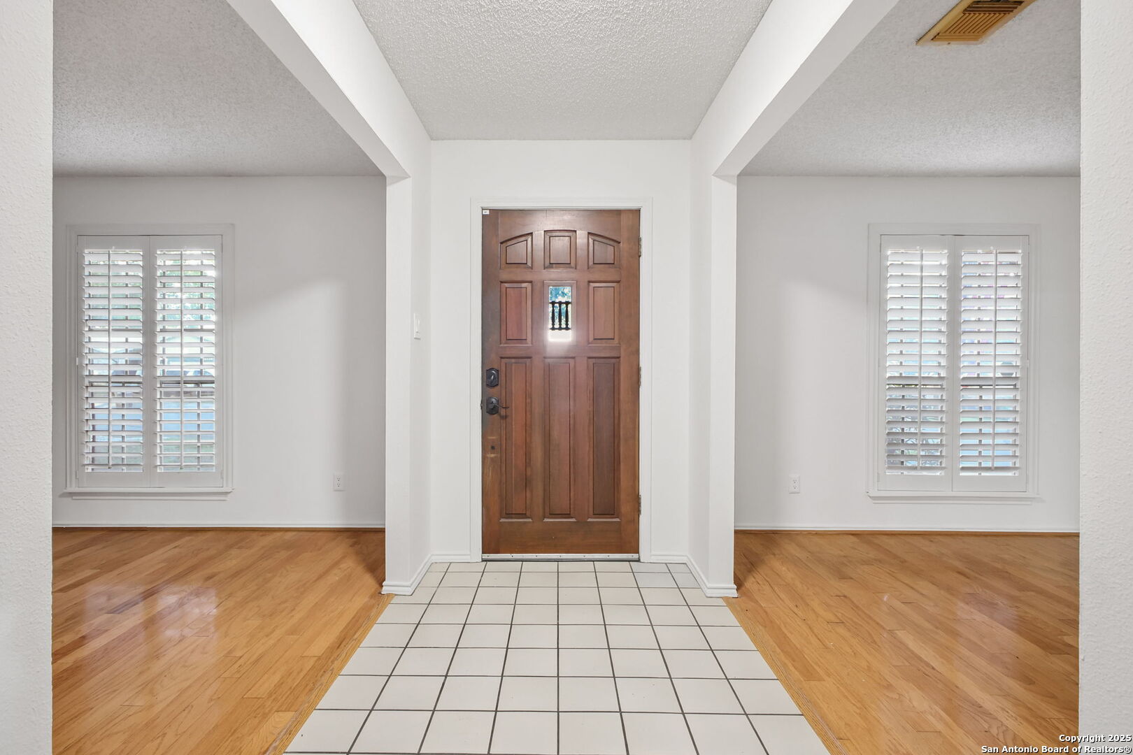 15319 Pebble Path San Antonio, TX 78232 - Photo 3 of 29 a view of an empty room and window