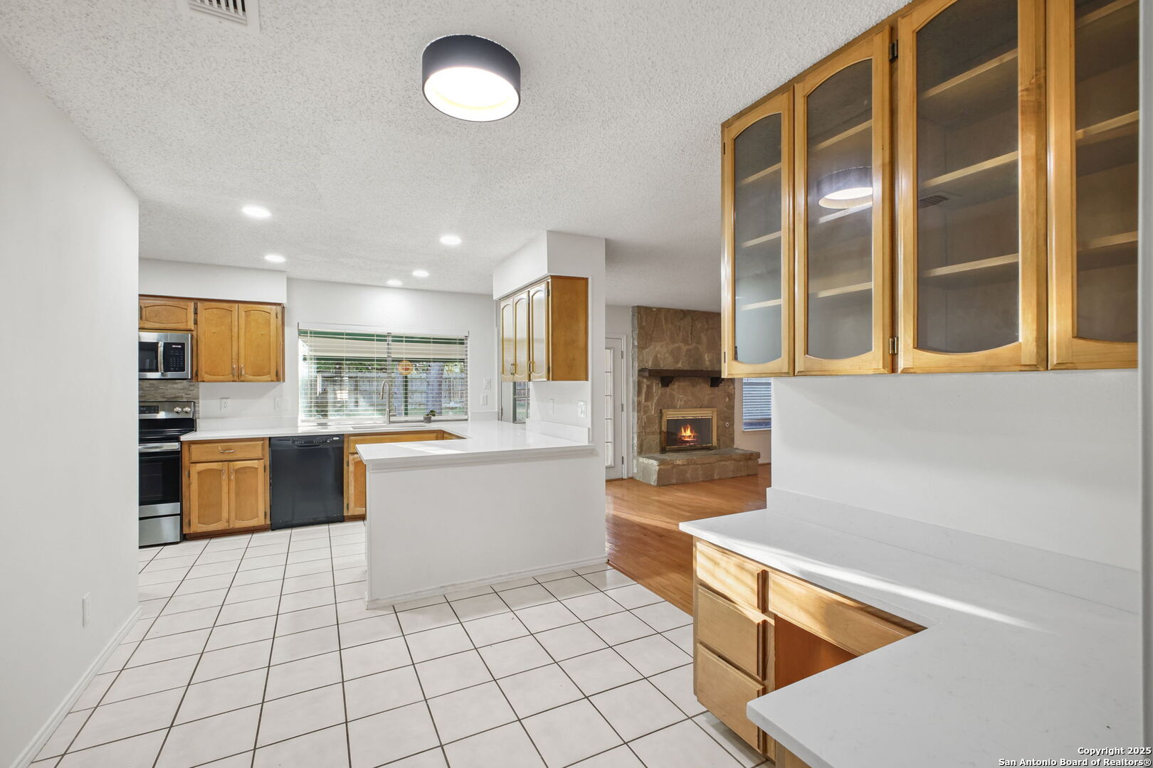 15319 Pebble Path San Antonio, TX 78232 - Photo 10 of 29 a large kitchen with a large counter top space and stainless steel appliances
